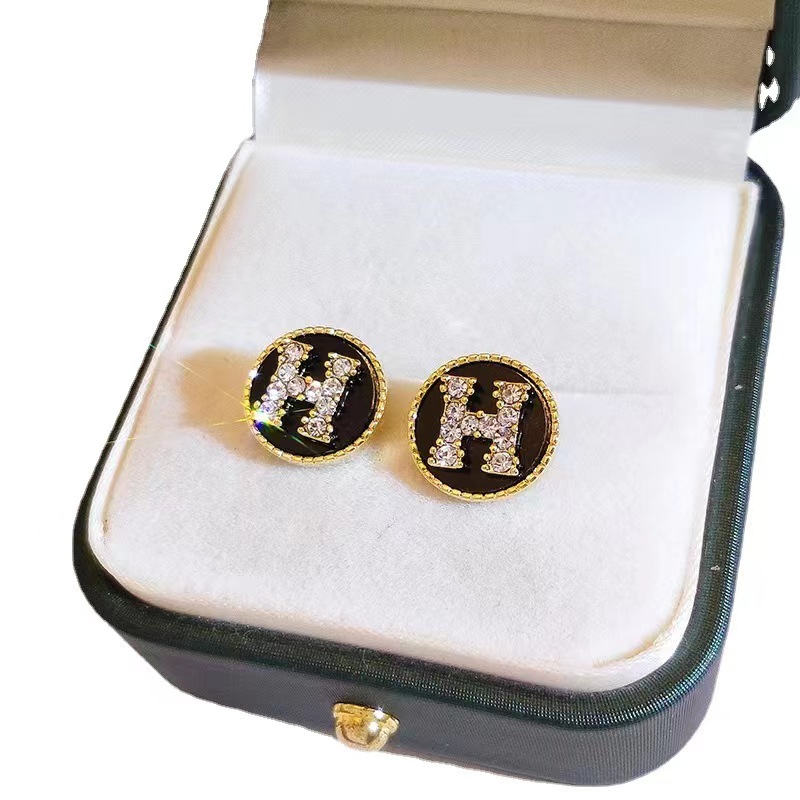 Hermes H circle crystal earrings