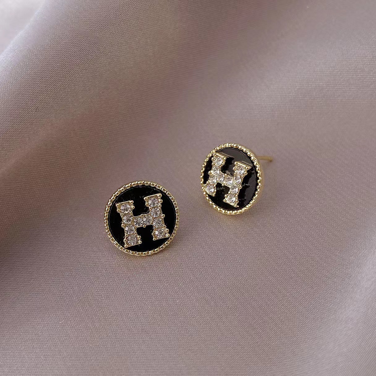 Hermes H circle crystal earrings