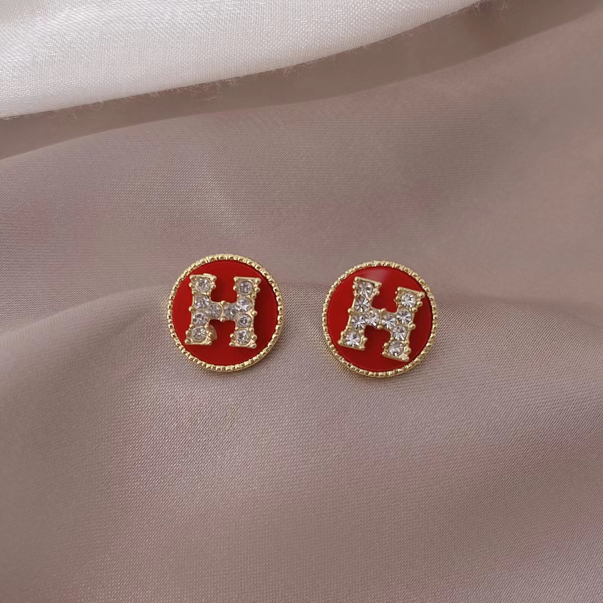 Hermes H circle crystal earrings